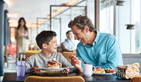 Father & Son enjoying breakfast at World Fresh Marketplace