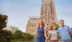 Family walking by La Sagrada Familia in Barcelona