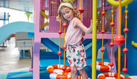 Child enjoying Water's Edge splash park on Star of the Seas