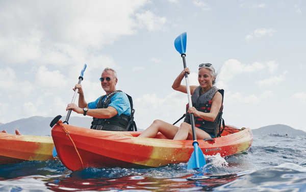 Couple kayaking off Star Seeker watersports platform