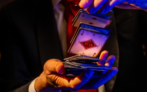 Magician at Spellbound on Star Princess shuffling cards