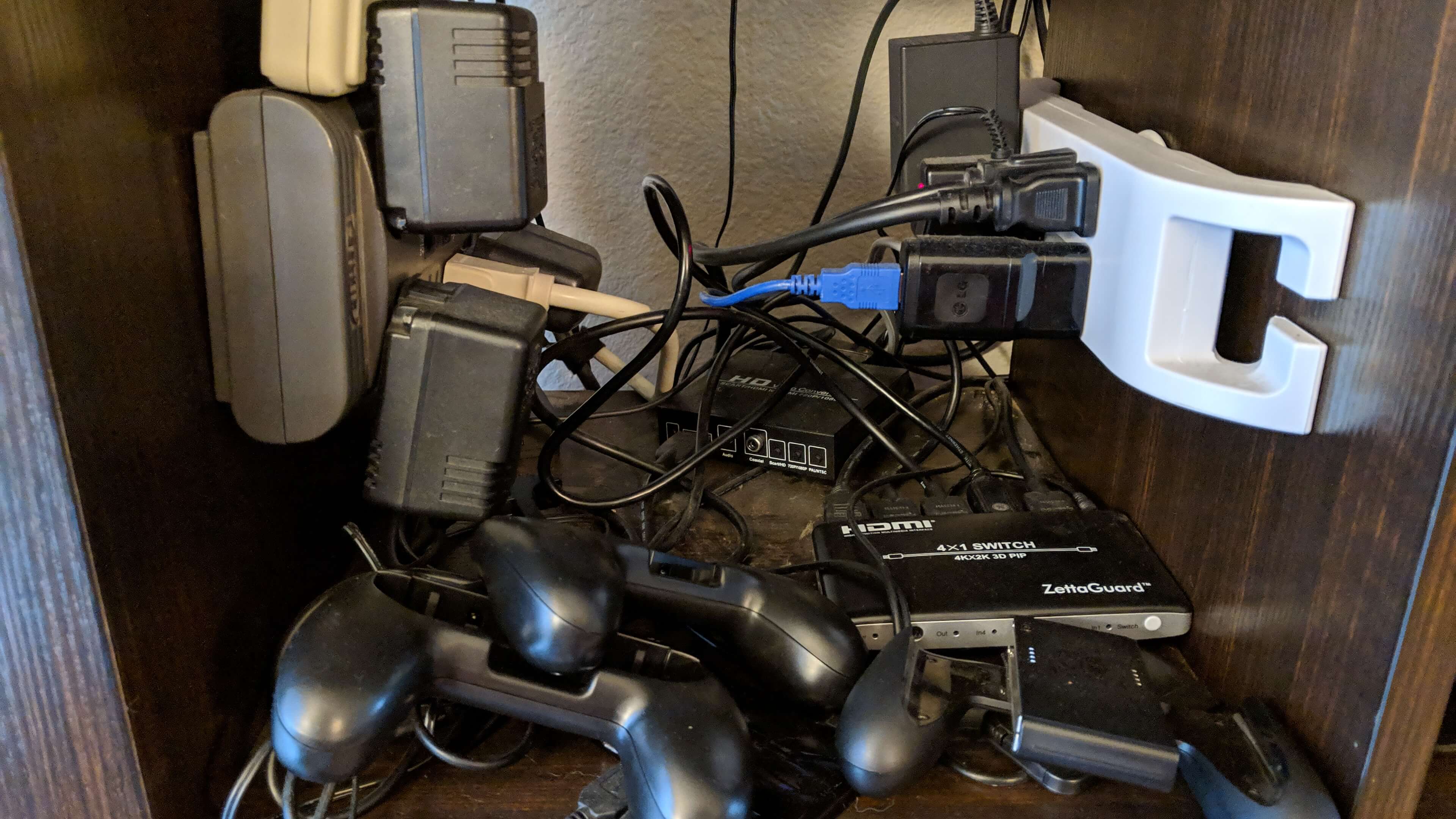 image of messy cables, power strips, power adapters for retro game consoles