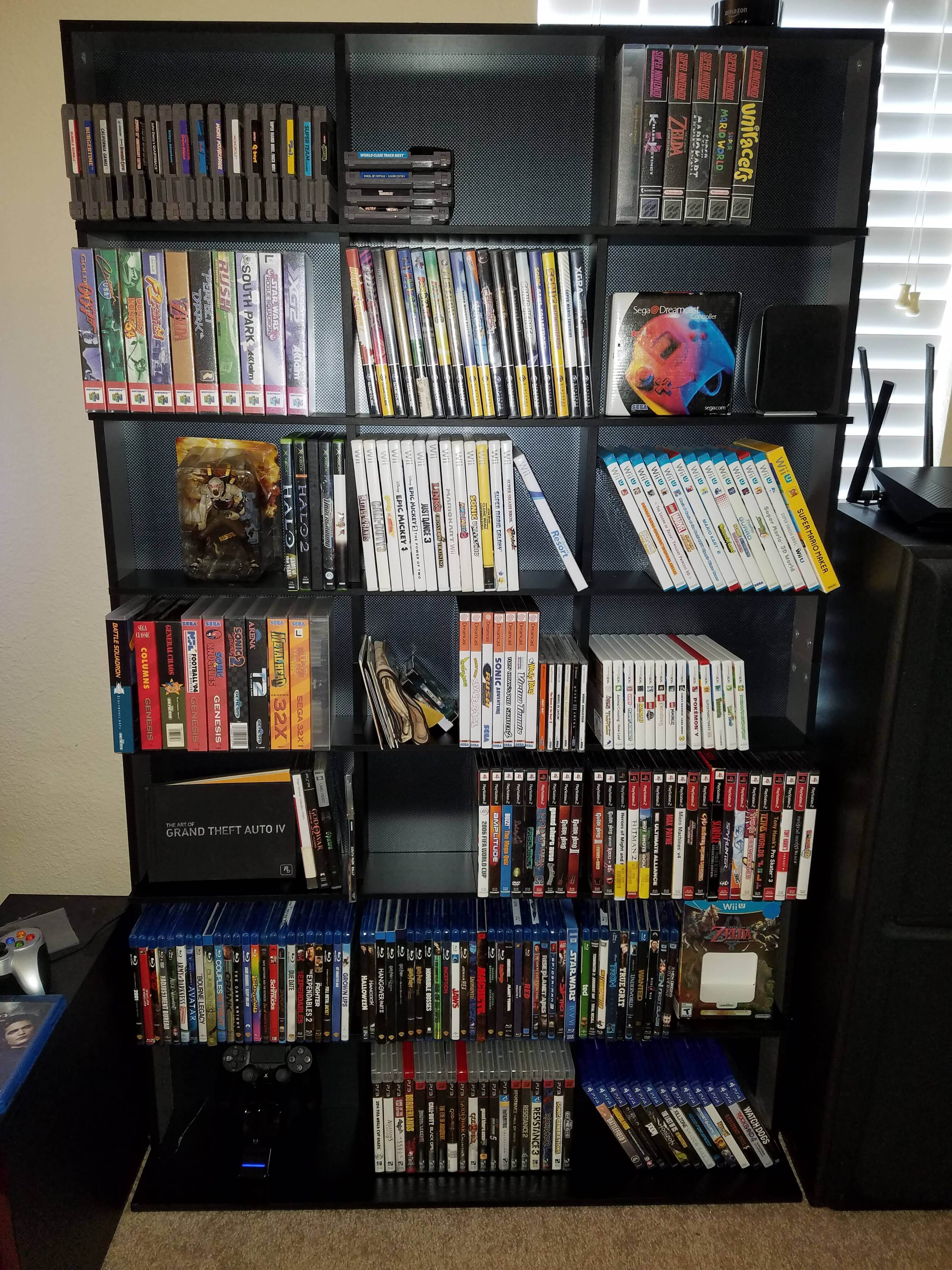 earlier photo of Joey Gauthier's game collection, both retro games and modern games in custom cases