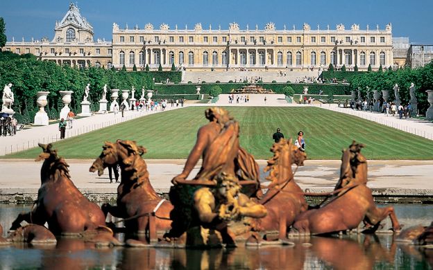Majestic front view: Versailles Palace's regal facade, an awe-inspiring testament to architectural splendor and history.
