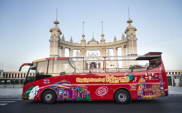 City Sightseeing Palermo Hop-On Hop-Off bus patiently parked, ready to welcome passengers and embark on an adventure through Palermo.
