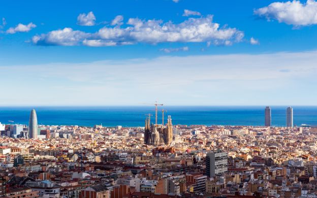 Breathtaking aerial view: Barcelona's beauty, mesmerizing cityscape, and vibrant urban panorama with houses and sea.