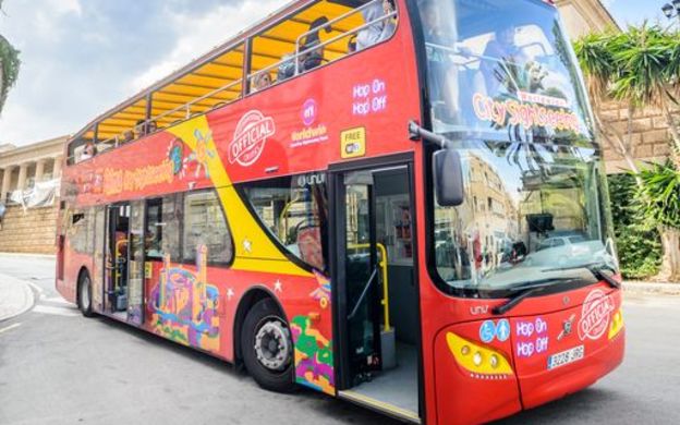 City Sightseeing Mallorca Hop-On, Hop-Off bus filled with eager passengers, ready to embark on an exciting exploration of Mallorca.