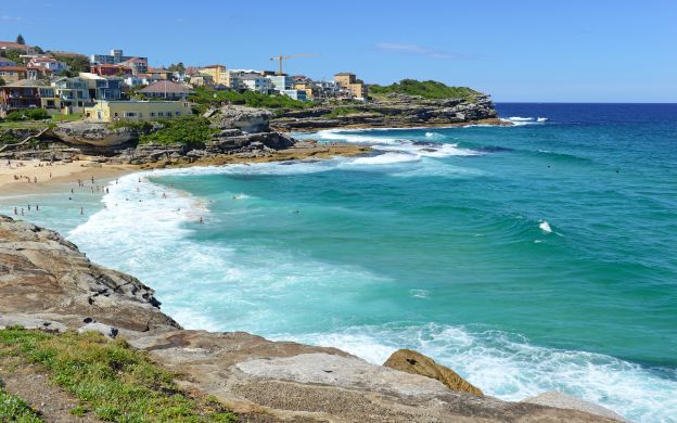 A gondolier guides tourists through Venice's enchanting canals, offering breathtaking views of the city's captivating beauty.