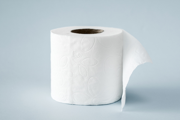 Roll of toilet paper on blue background