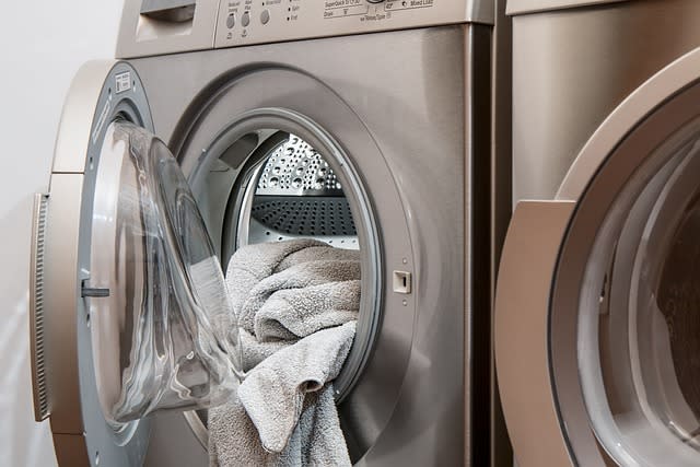 A modern washing machine with a soft towel