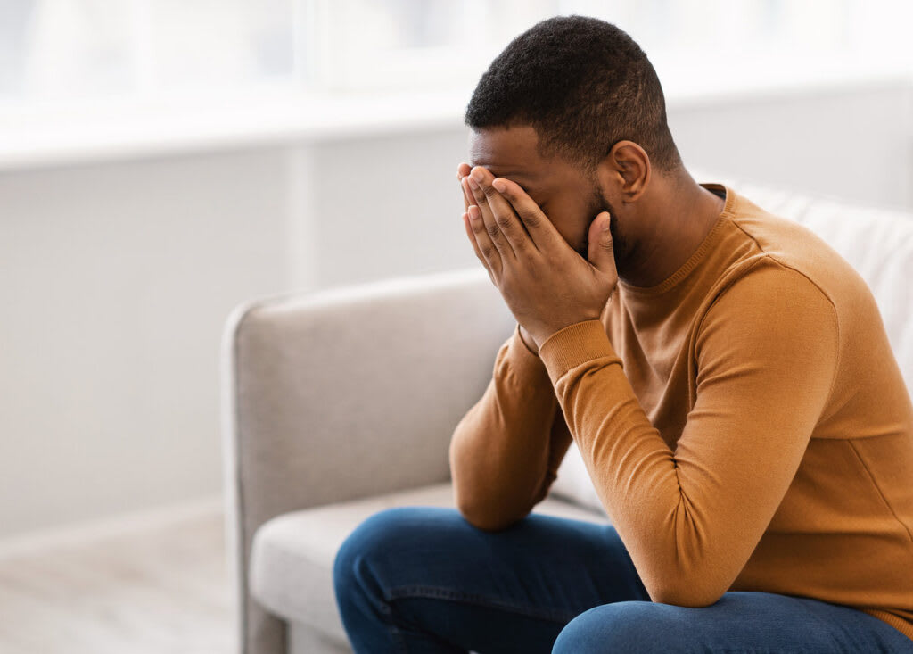 A person in a quiet moment of distress and reflection