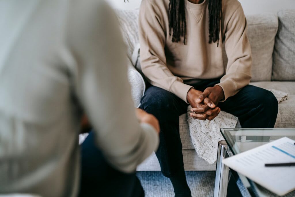 Two people in a quiet, reflective conversation