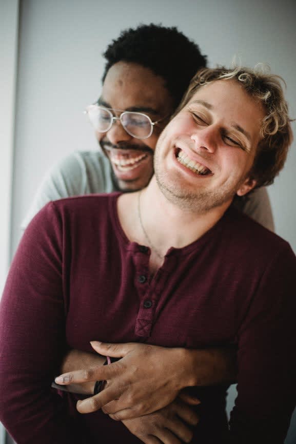 A couple embracing and laughing together