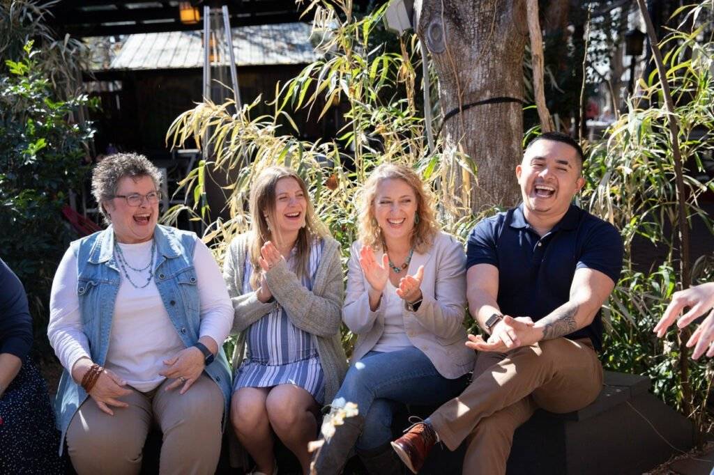 Friends laughing together in a joyful celebration