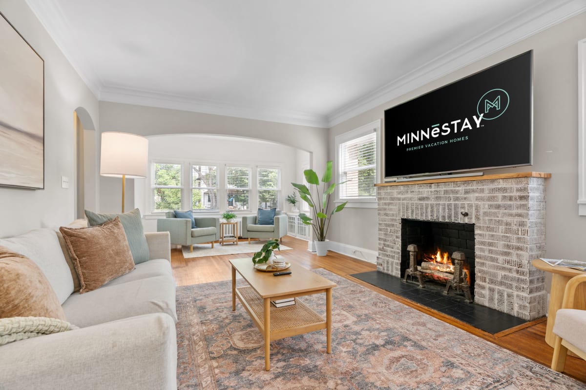 A cozy and bright living room with a modern design, featuring a soothing color palette.