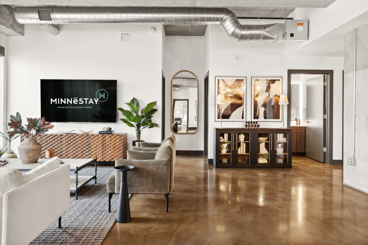 A stylish and modern open-concept living space featuring contemporary furniture and vibrant decor.