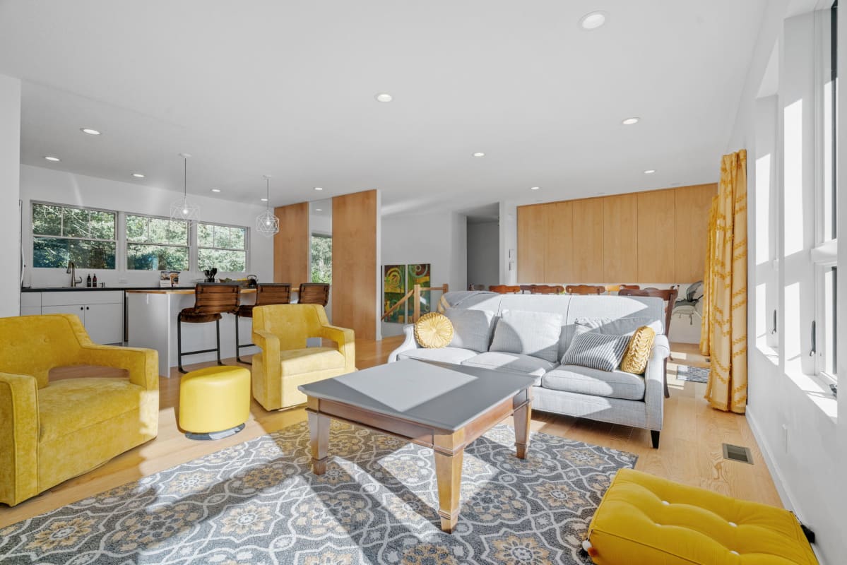 A vibrant living area featuring yellow accents and modern design.