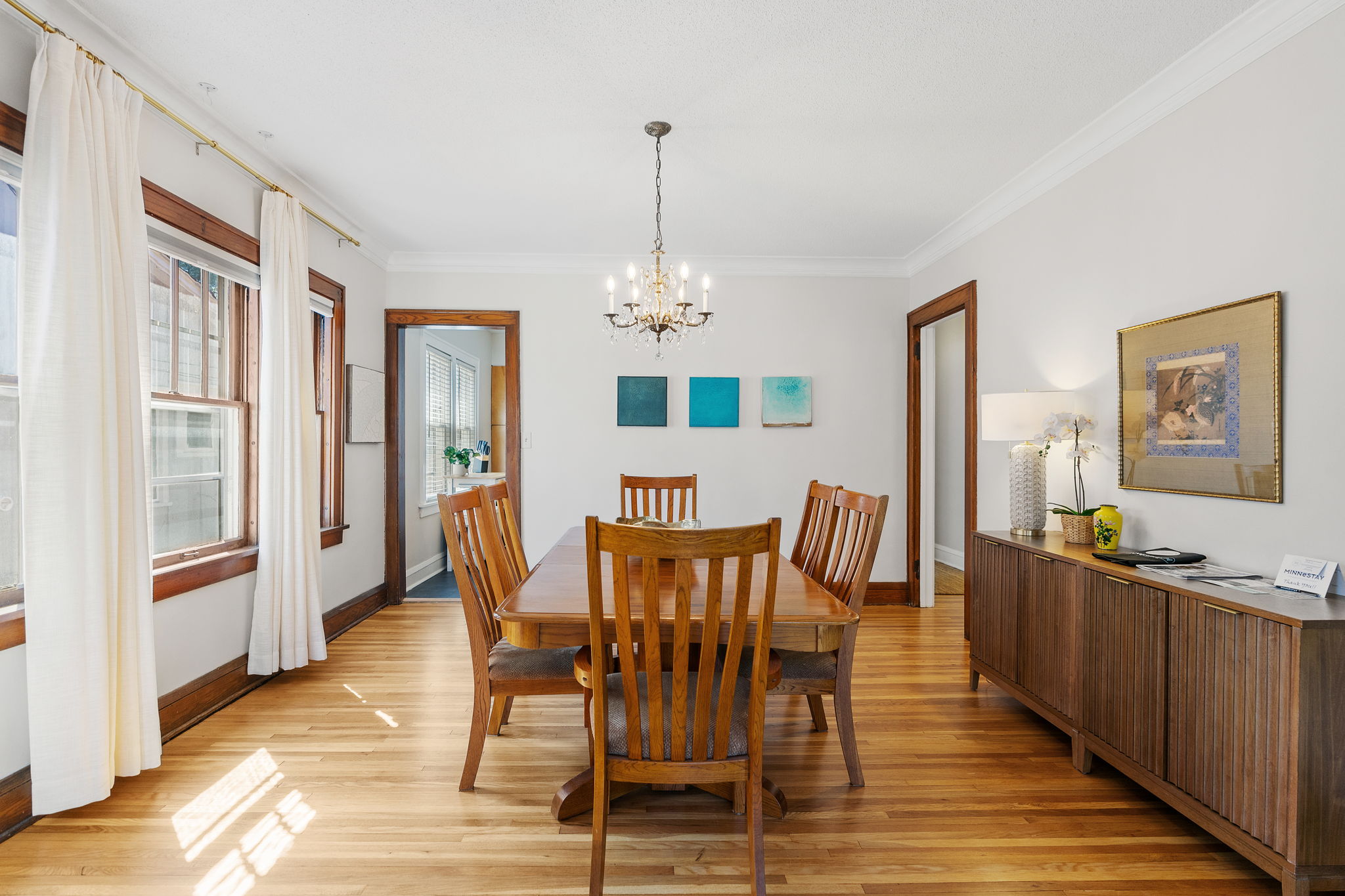 A beautifully designed dining room with elegant decor and natural light.