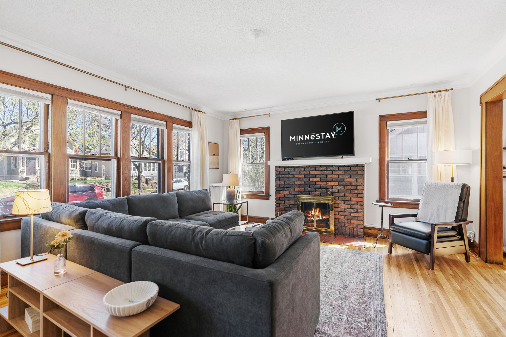 Bright and inviting living room with a modern fireplace.