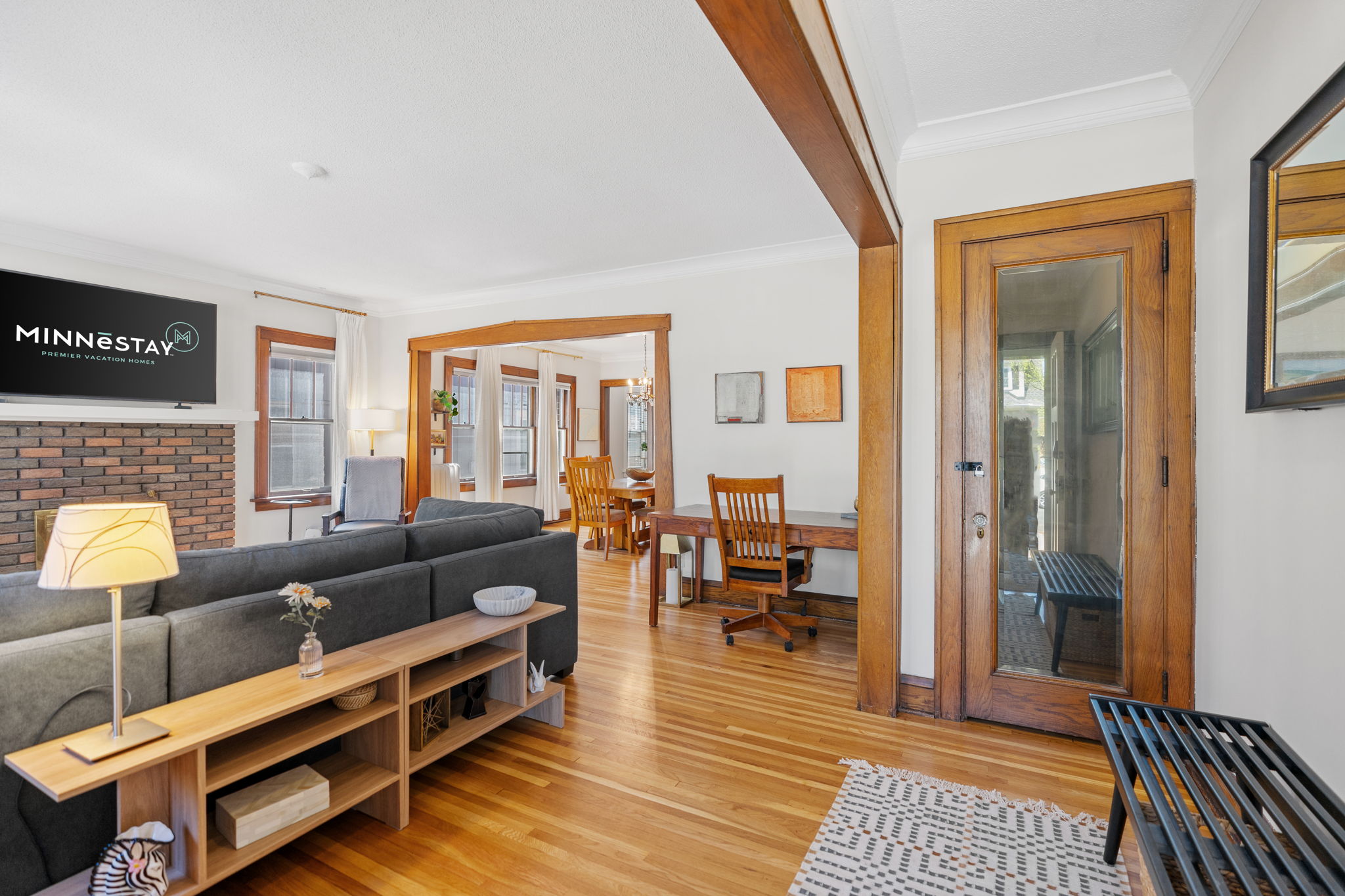 Inviting living area with modern decor and warm wooden accents.