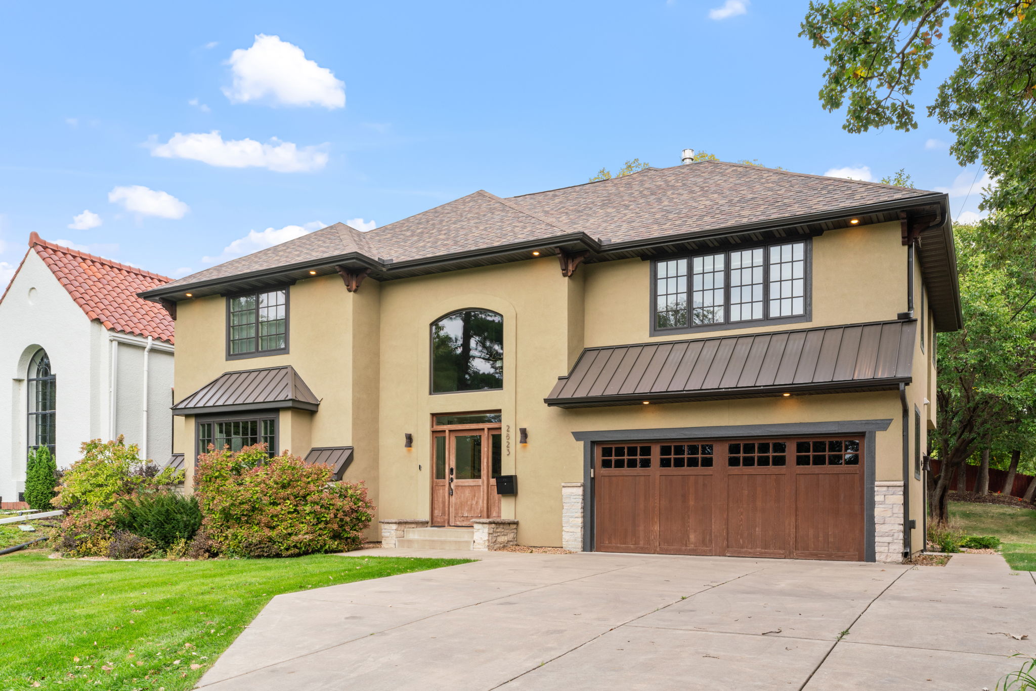 Stylish two-story home with modern aesthetic and classic touches.