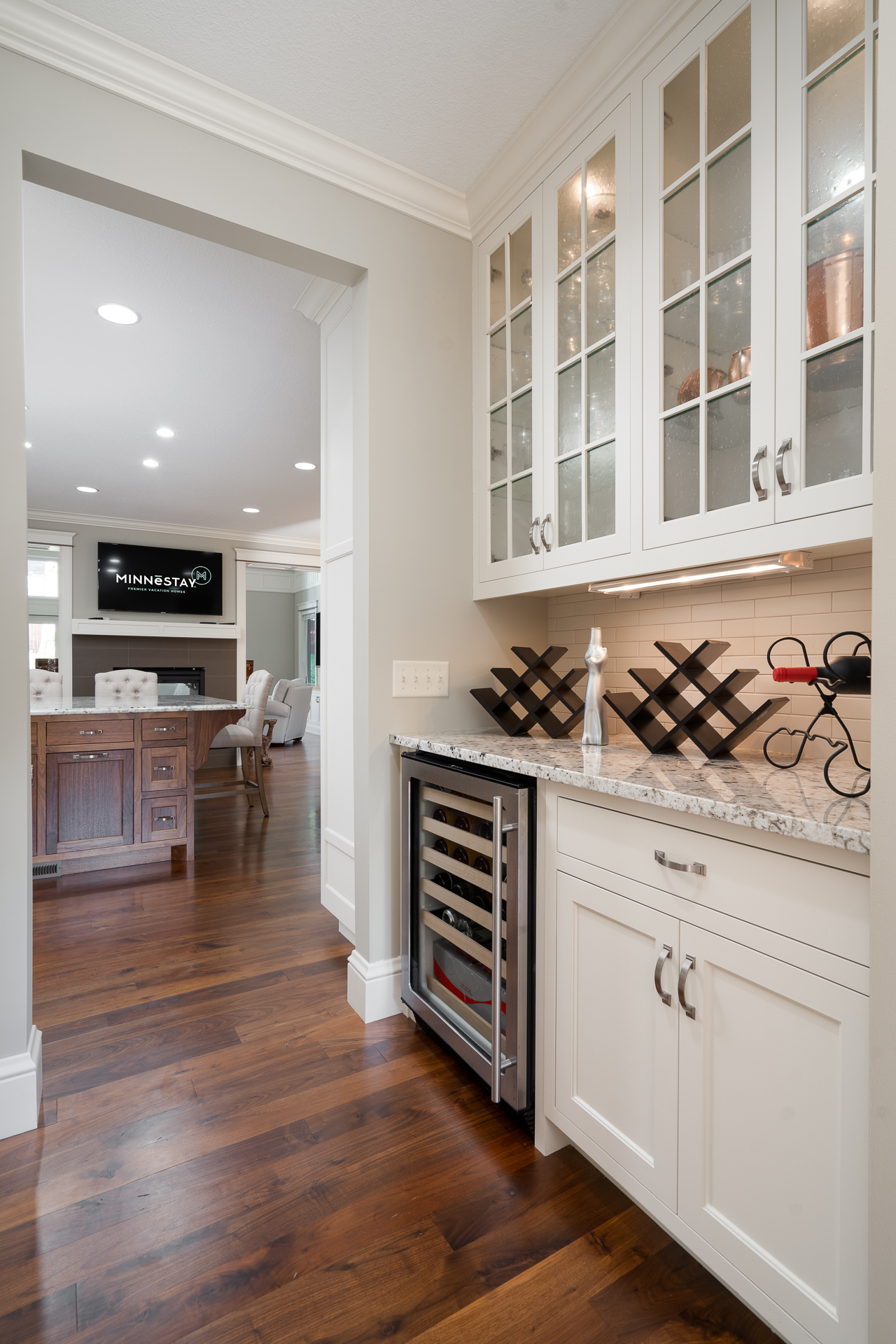 Modern kitchen with stylish cabinetry and wine fridge.