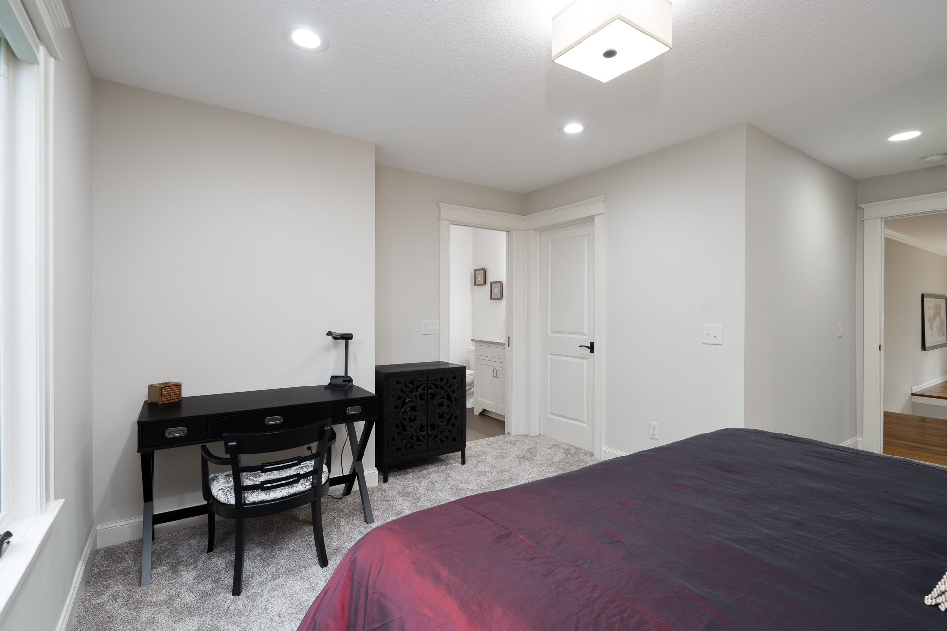 A contemporary bedroom with minimalist decor and a warm atmosphere.