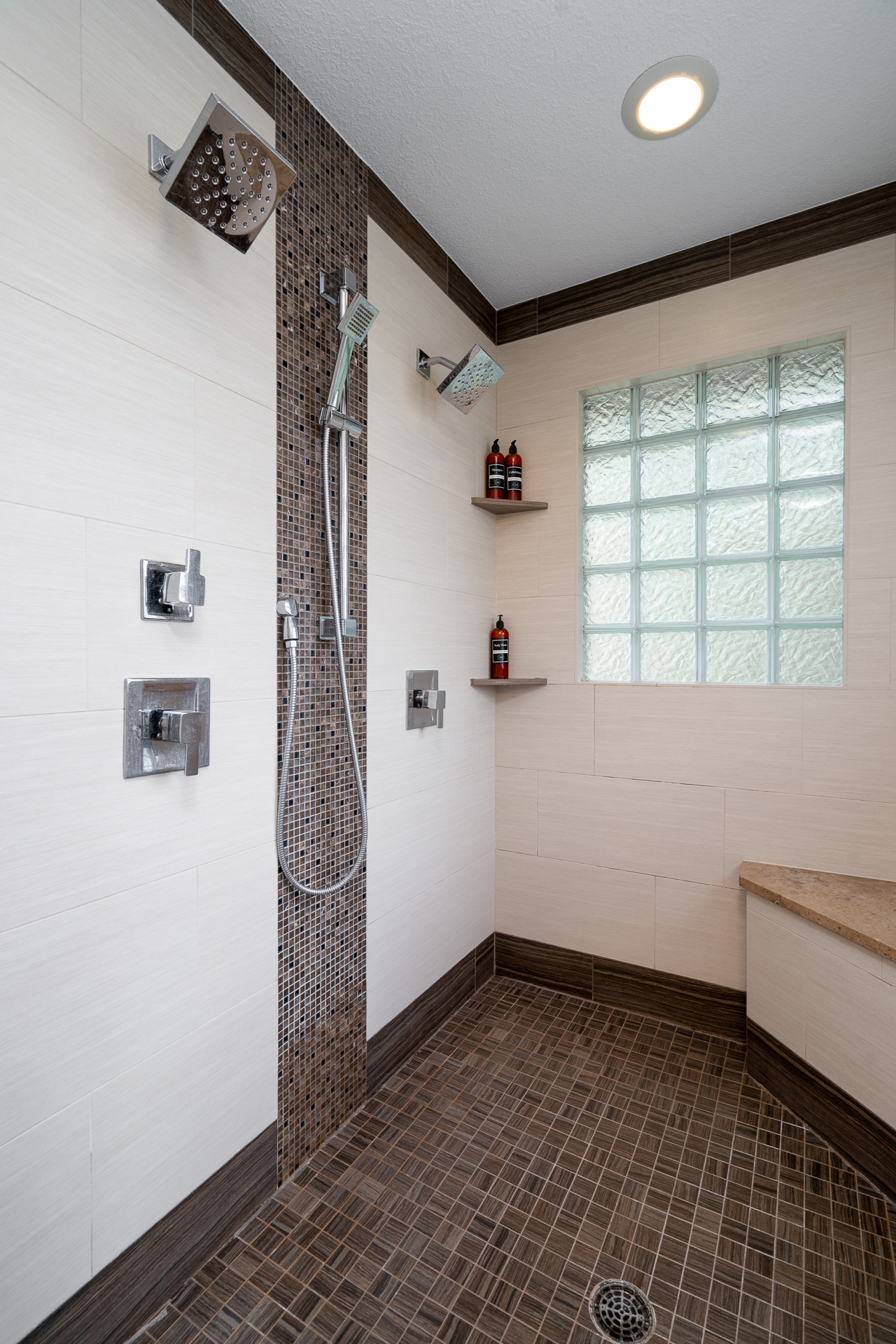 Stylish modern shower with dual shower heads and elegant tile work.