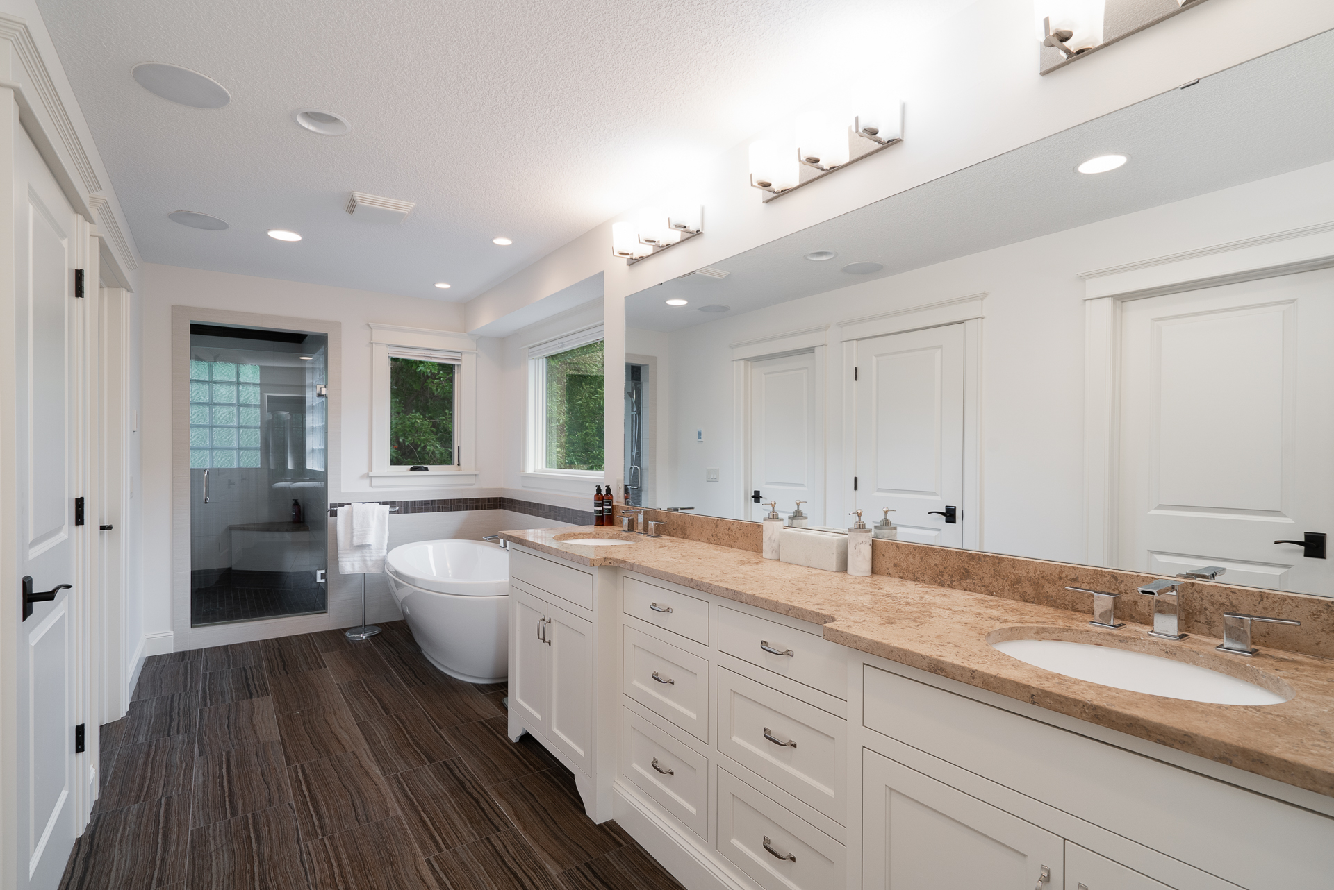 Spacious modern bathroom with sleek finishes and natural lighting.