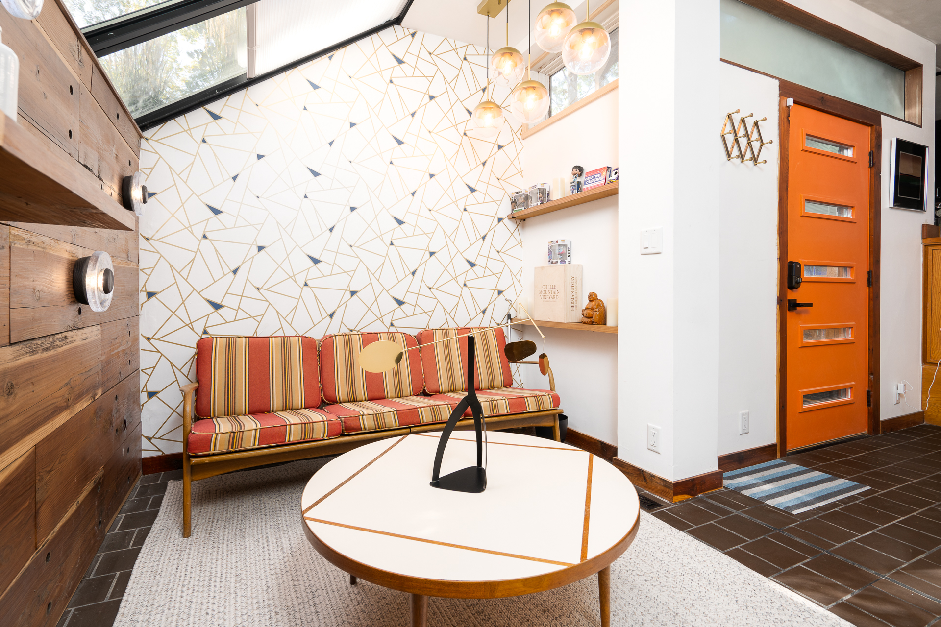 A stylish living area showcasing mid-century design with modern accents.