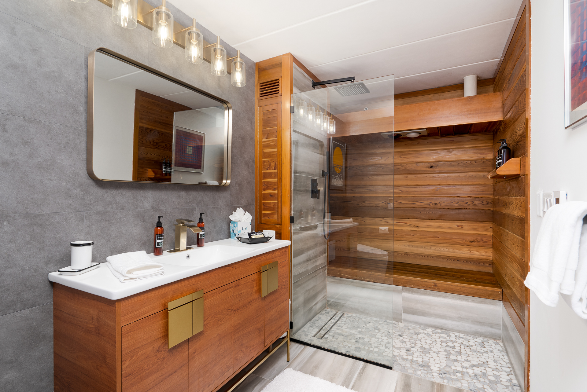 A modern and stylish bathroom with elegant wooden accents and a spacious walk-in shower.
