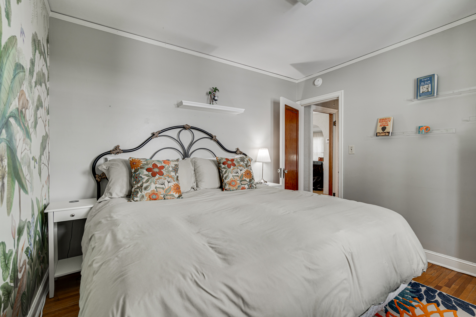 A cozy bedroom with floral accents and serene decor.