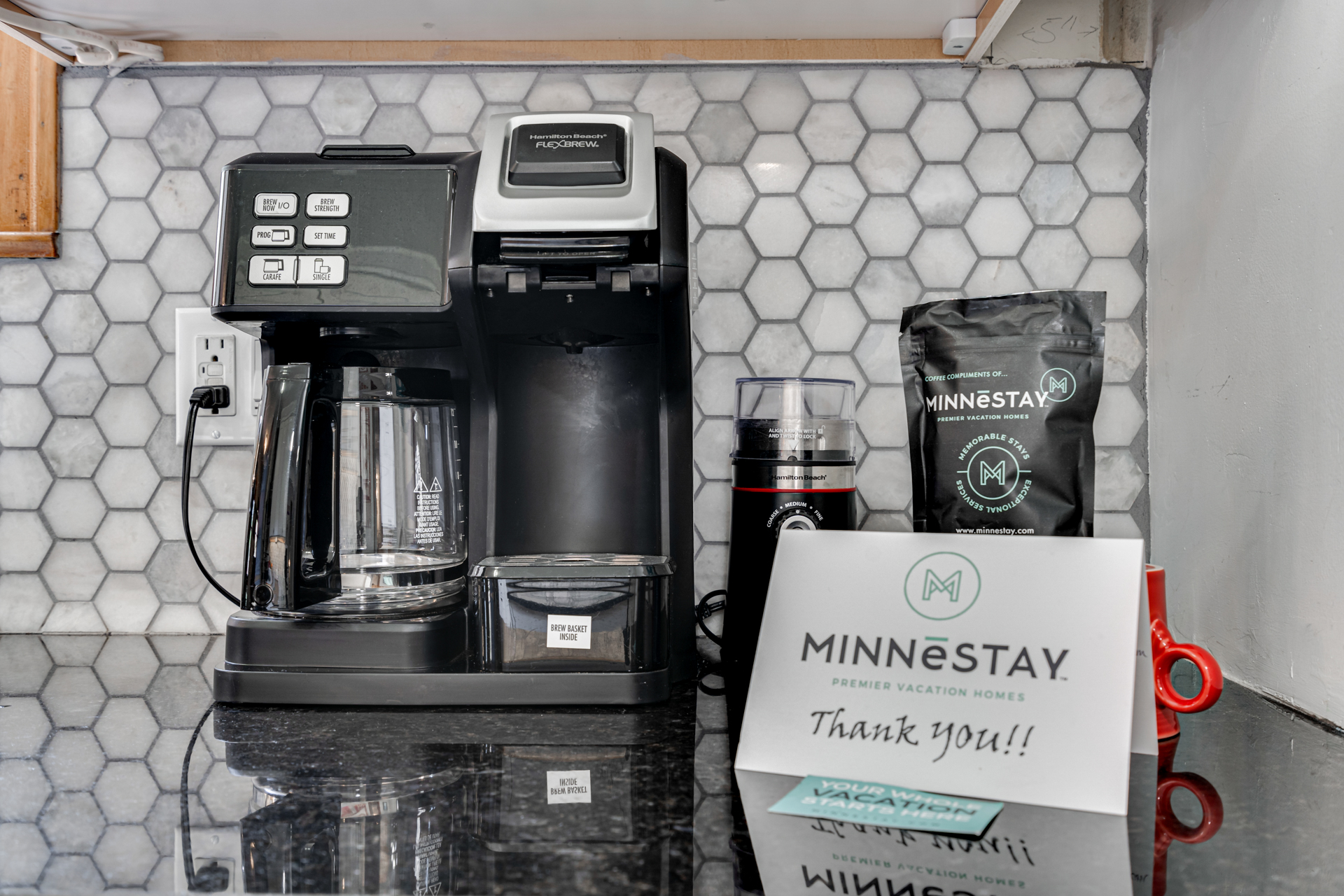 A modern coffee station featuring a Hamilton Beach FlexBrew and MINNESTAY coffee.