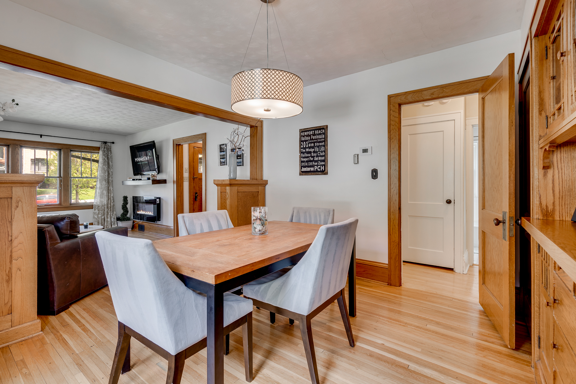 A warm and inviting dining area that opens into a cozy living space.