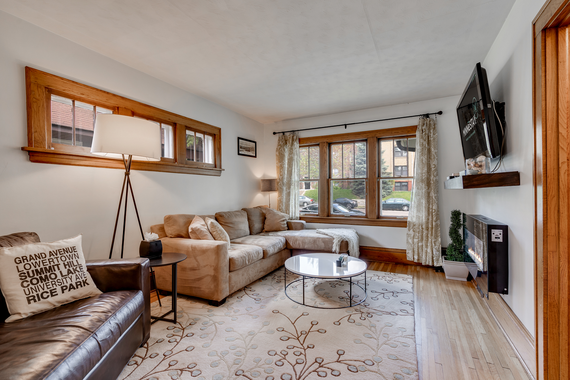 A cozy living room with a mix of modern and classic decor.