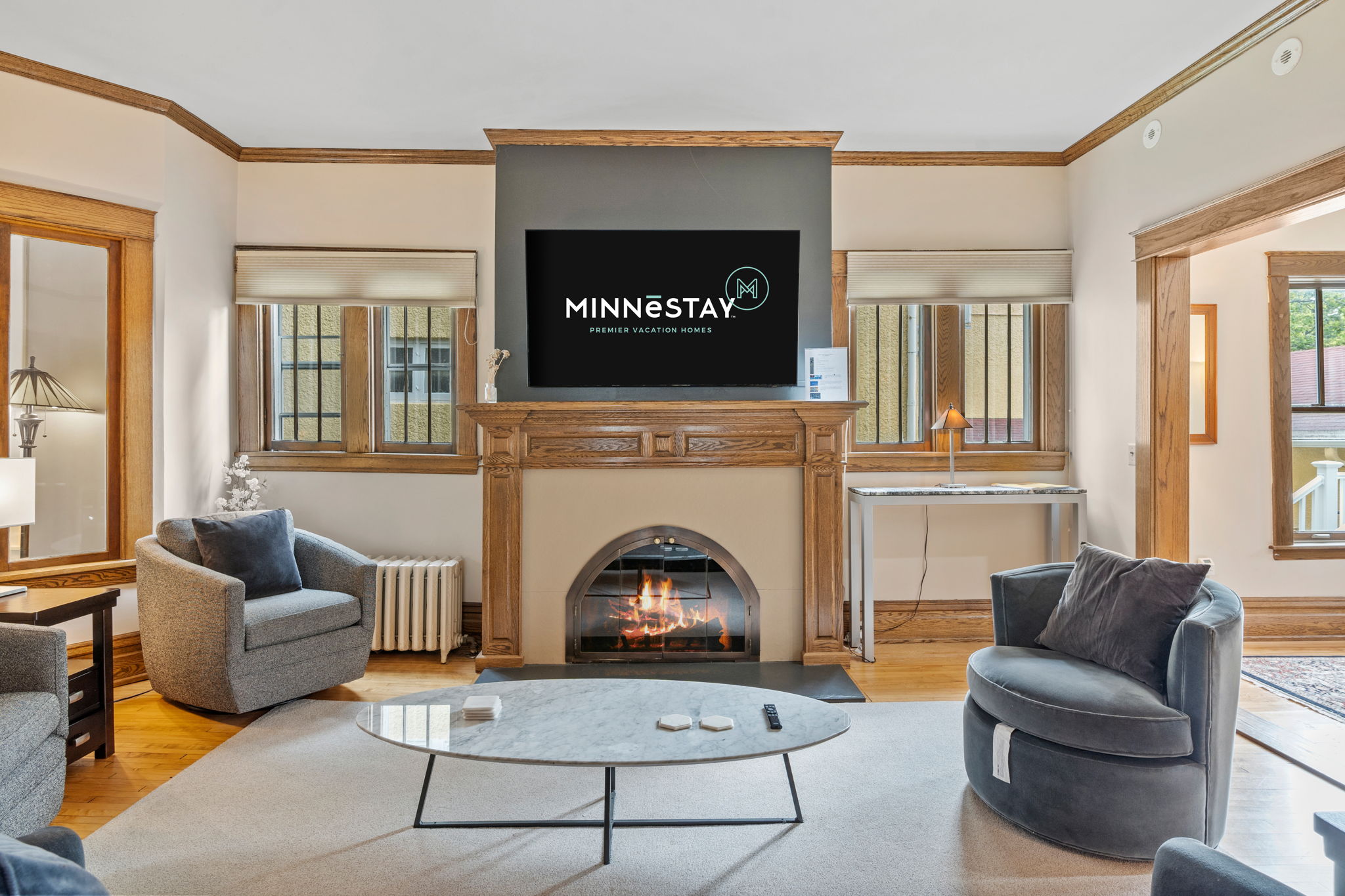 A cozy living room featuring modern amenities and classic decor.