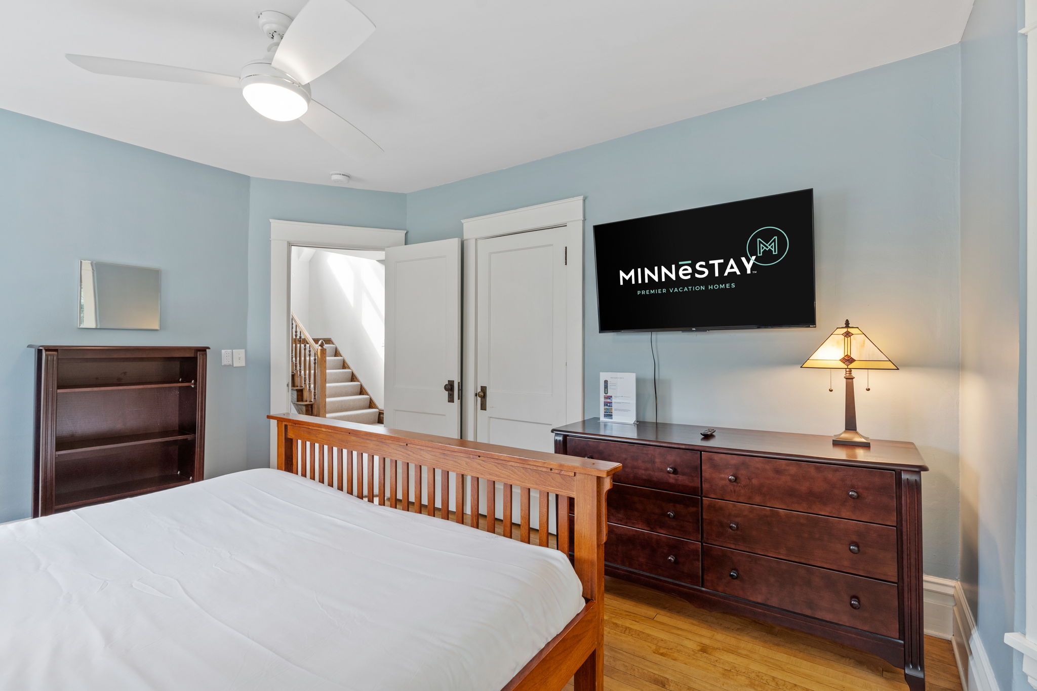 A modern bedroom featuring elegant decor and amenities.