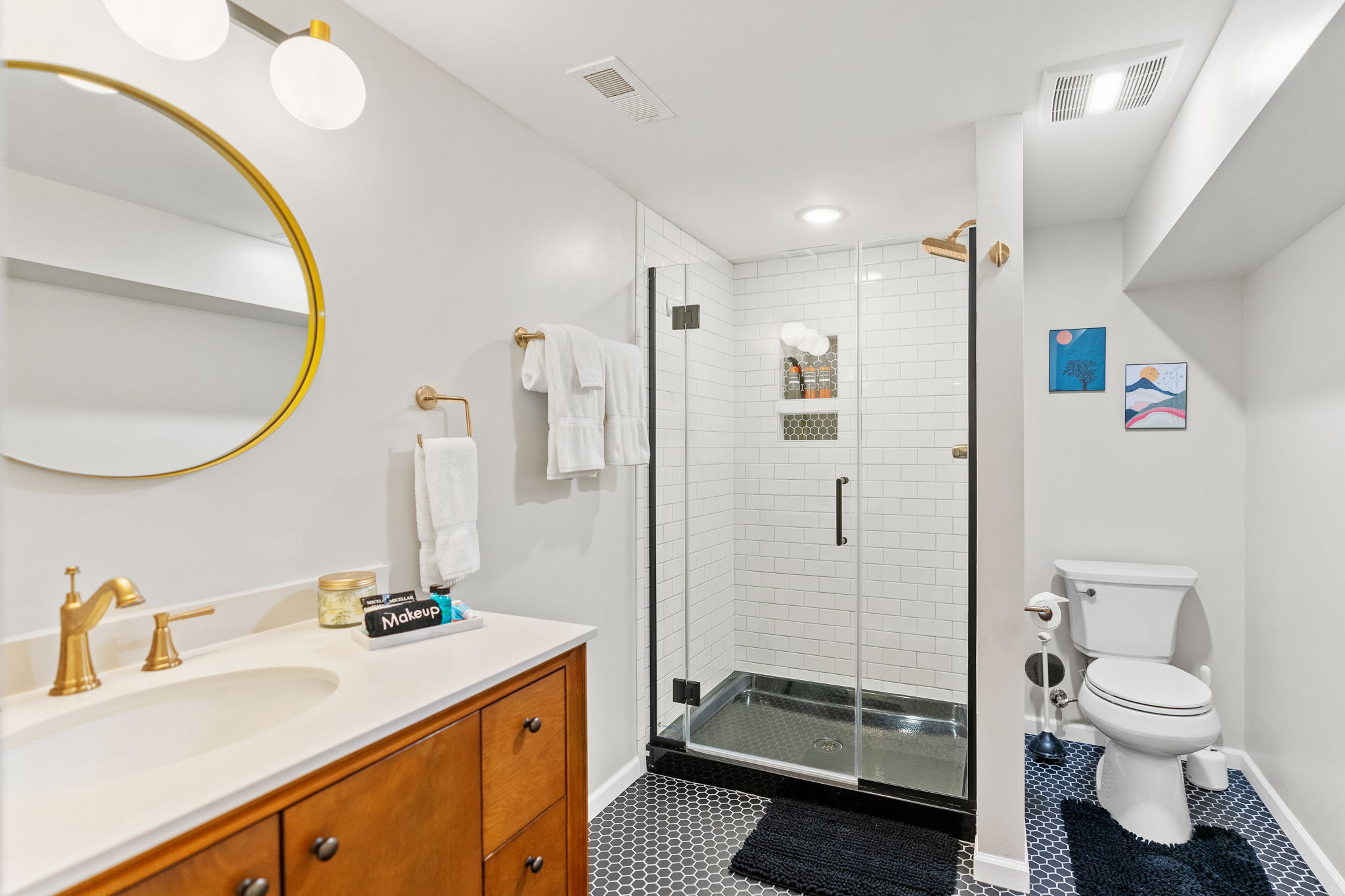 A modern bathroom featuring sleek fixtures and stylish decor.