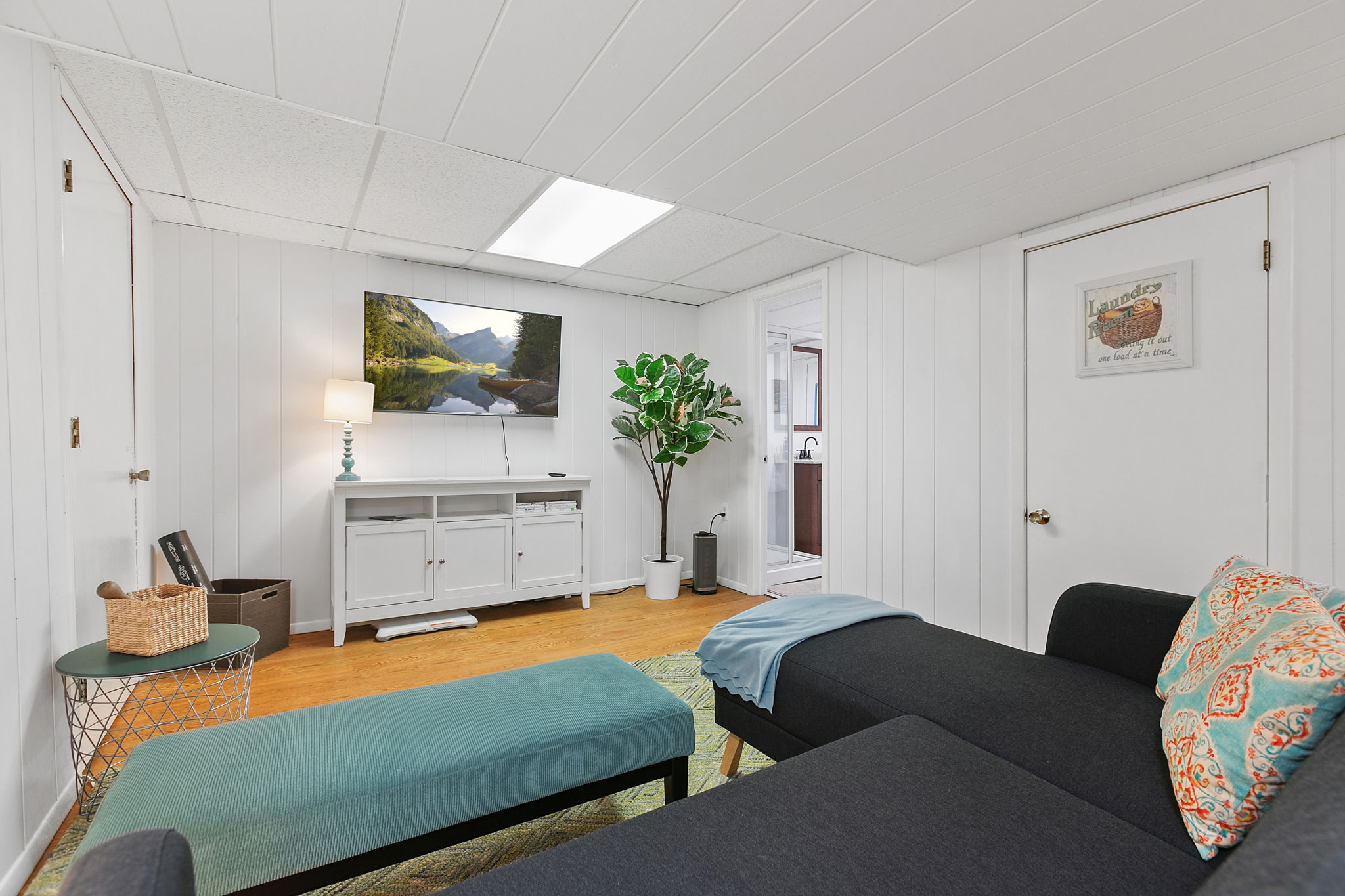 A bright and cozy living area featuring modern decor and a tranquil atmosphere.