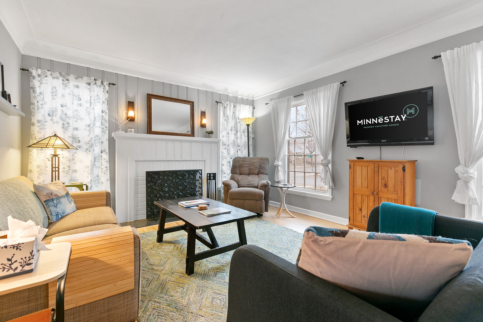 A bright and cozy living room featuring modern decor and comfortable seating.