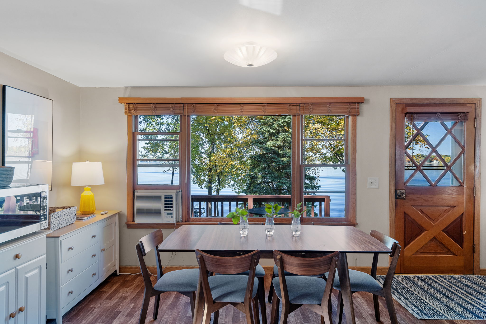 A cozy dining area with a beautiful view of the water.