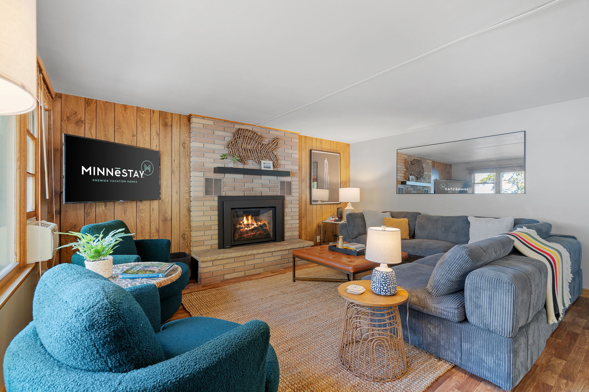 A cozy living room featuring a fireplace and charming furnishings.