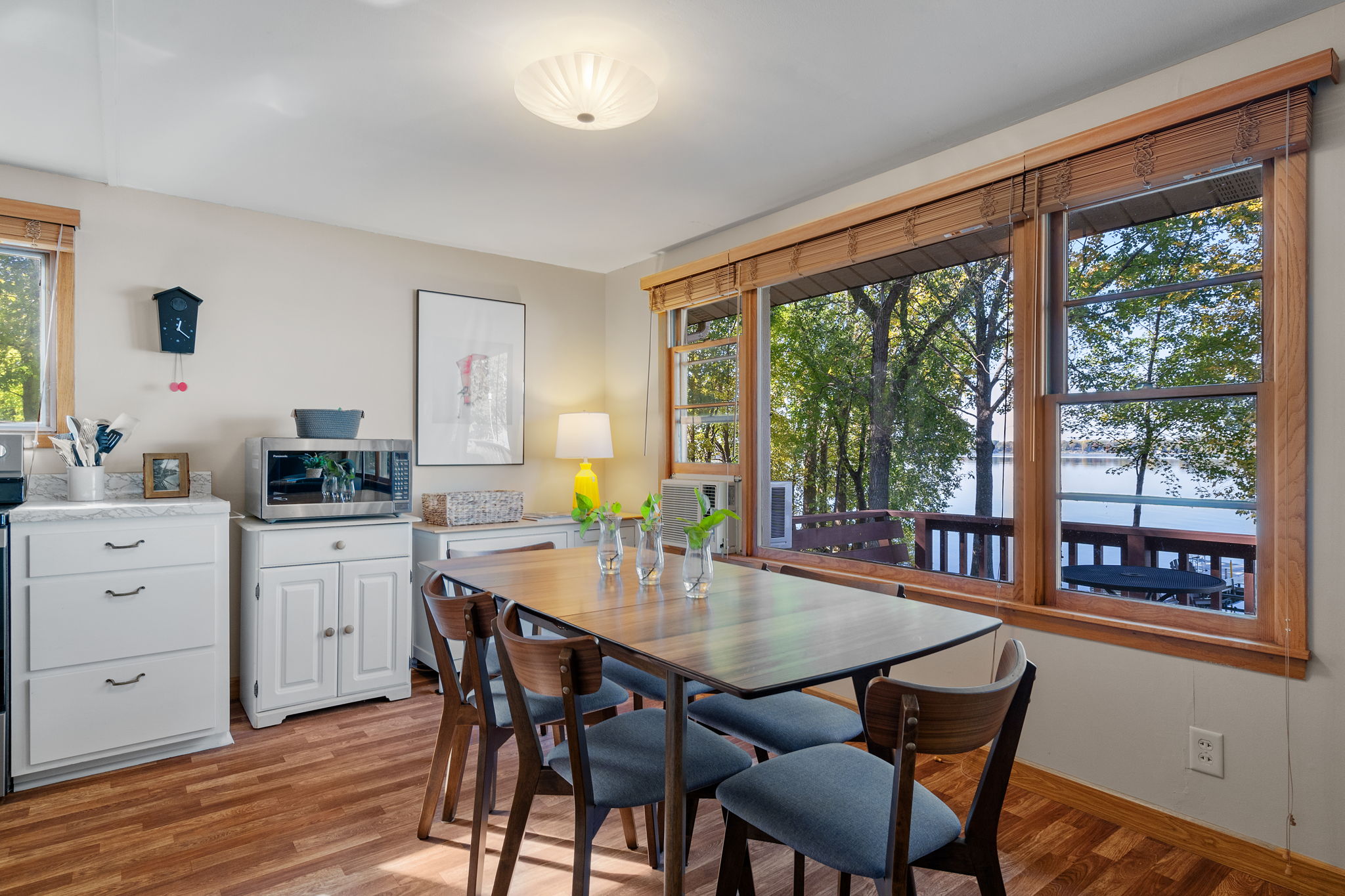 A cozy dining area with a serene view of nature.