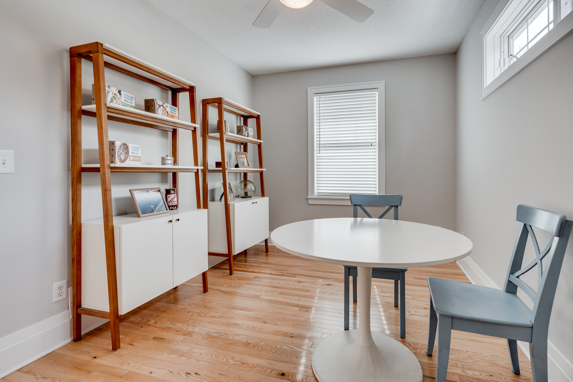 A bright dining area featuring modern decor and natural wood accents.