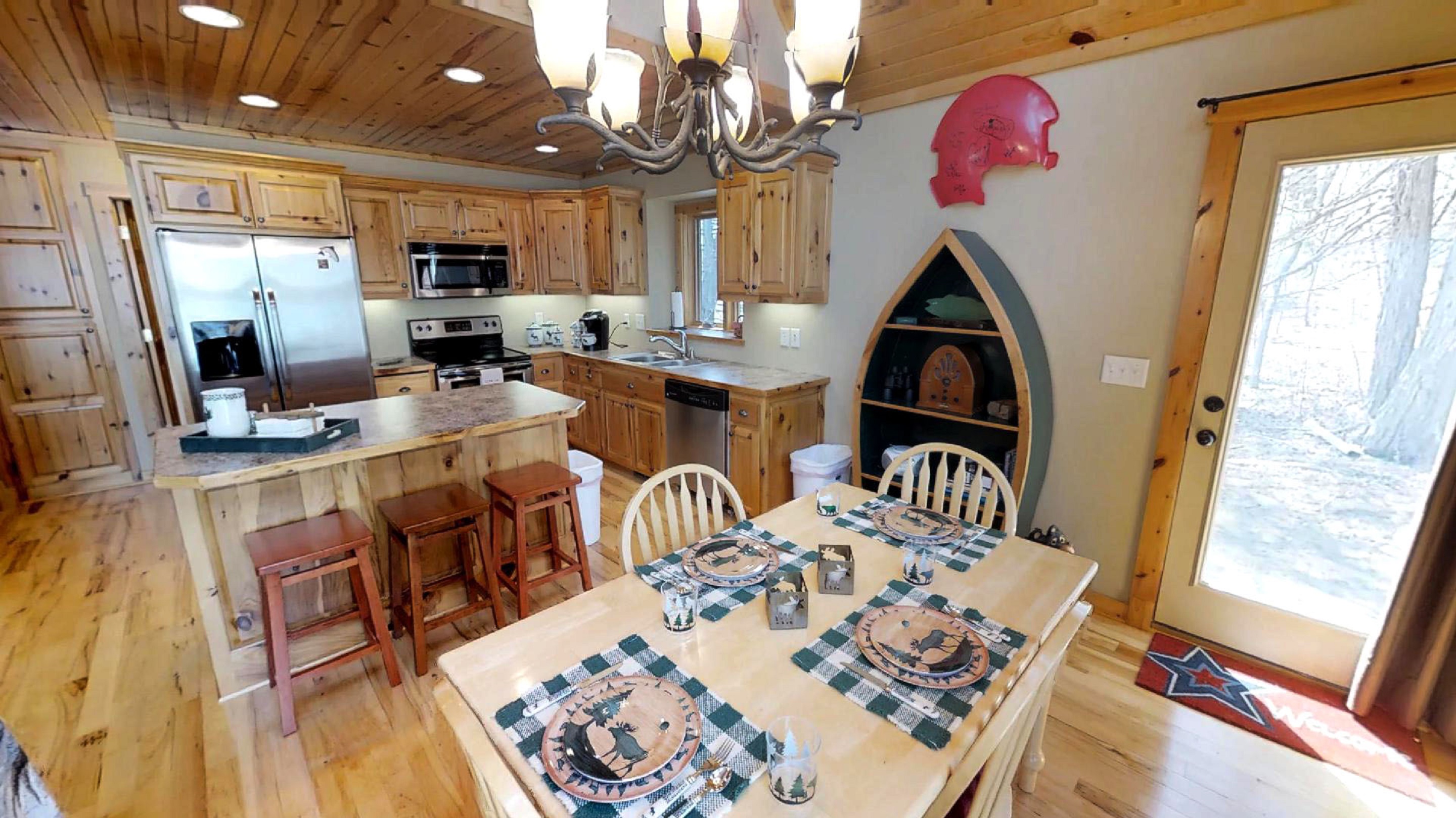 A rustic kitchen with a warm, cozy atmosphere featuring wooden cabinetry and inviting decor.