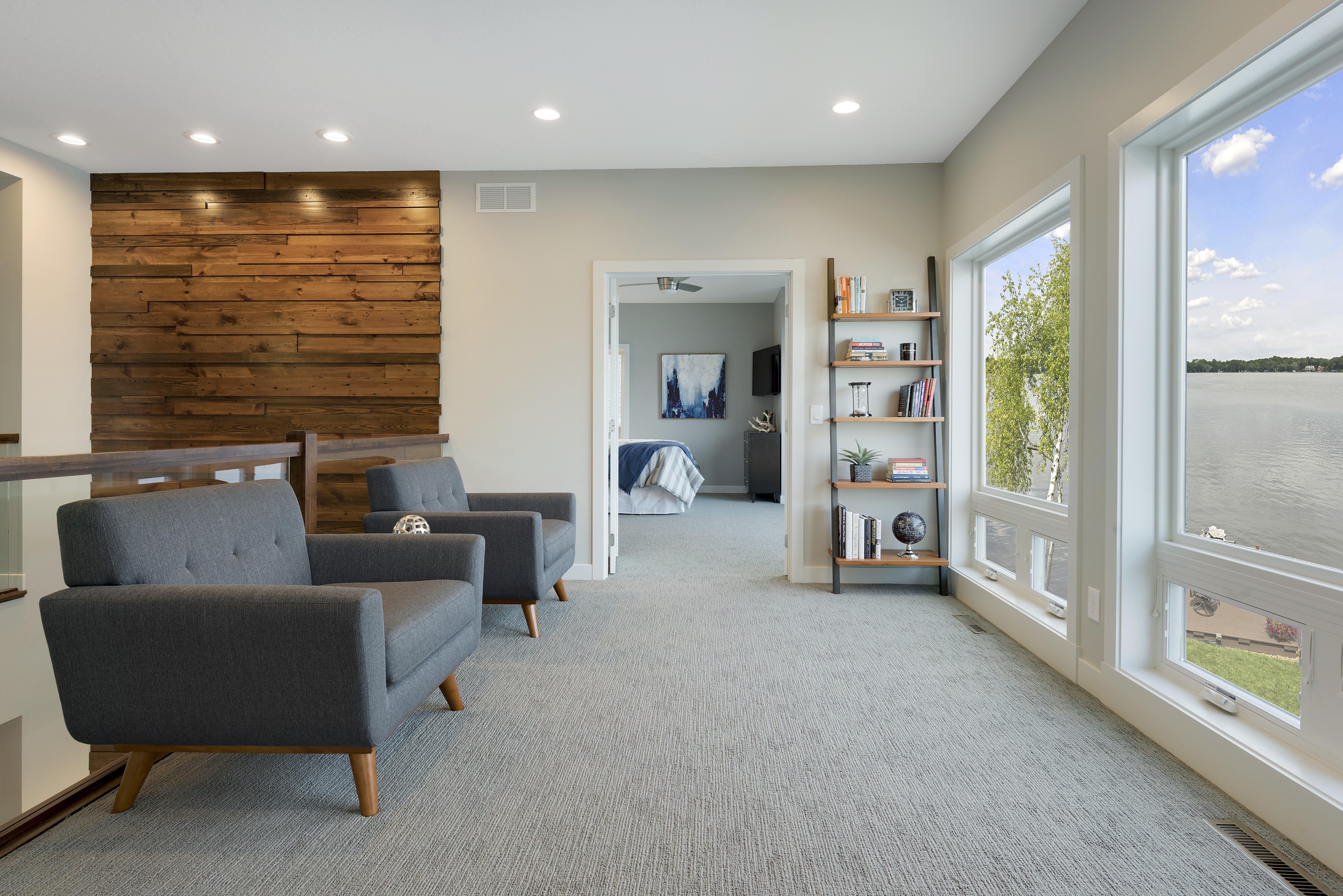 Bright and inviting living space with lake view and modern decor.