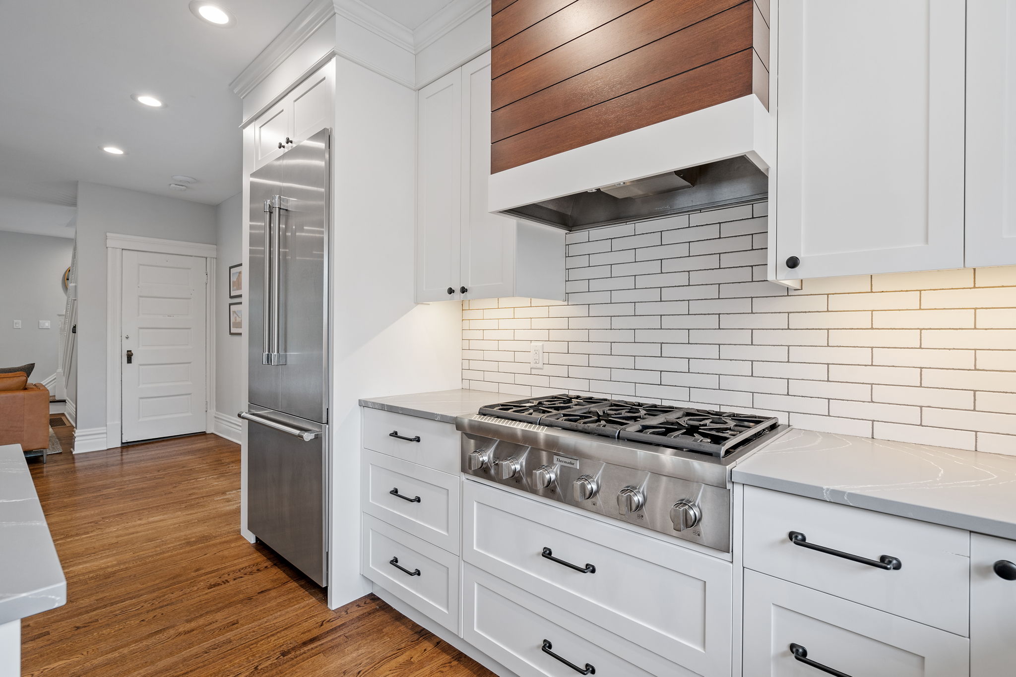 A modern kitchen featuring a stylish gas stove and sleek cabinetry.