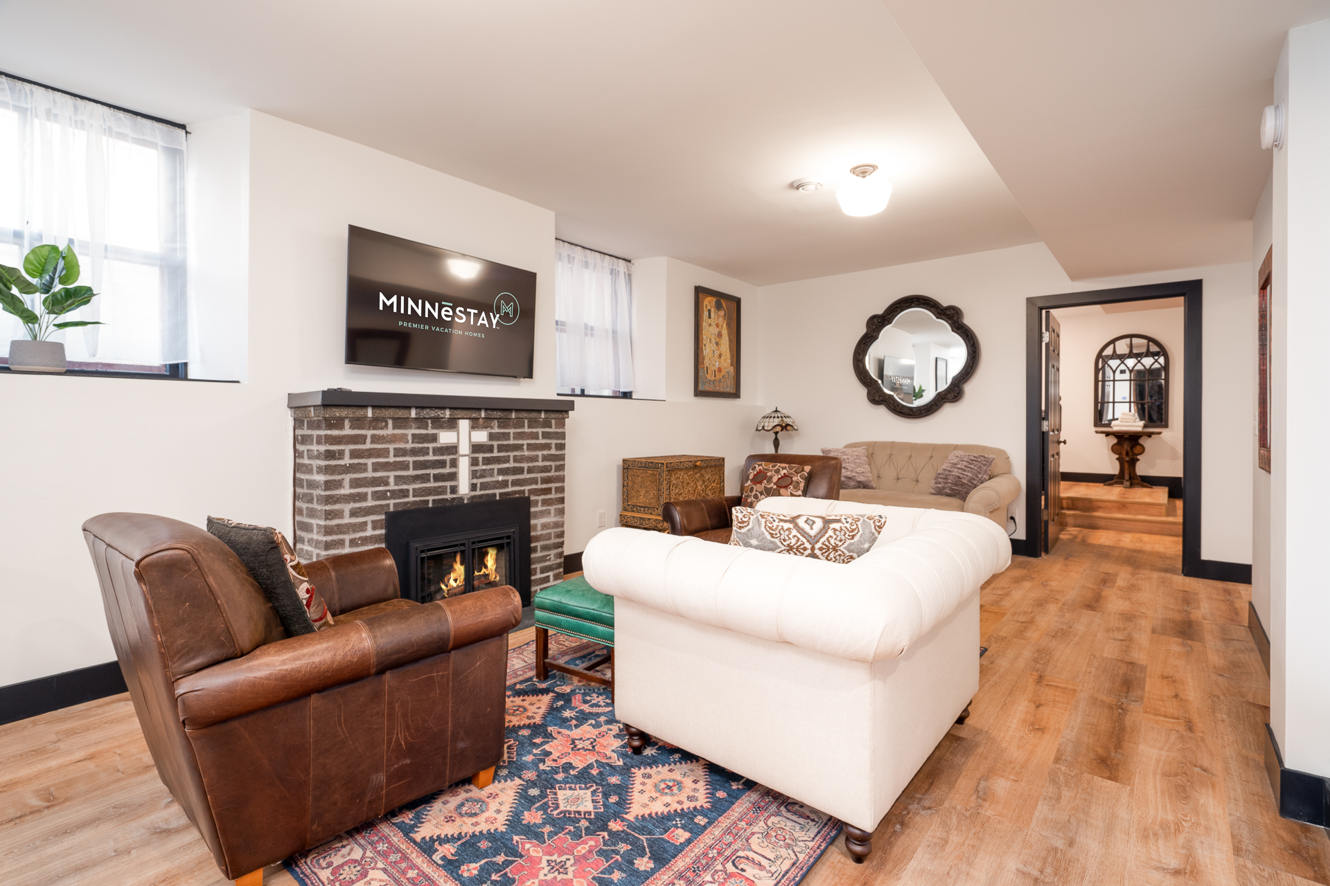 A stylish living room with cozy seating and modern amenities.