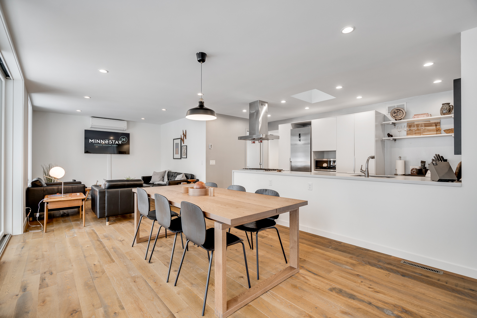 Modern open-concept living and dining area showcasing minimalist design.