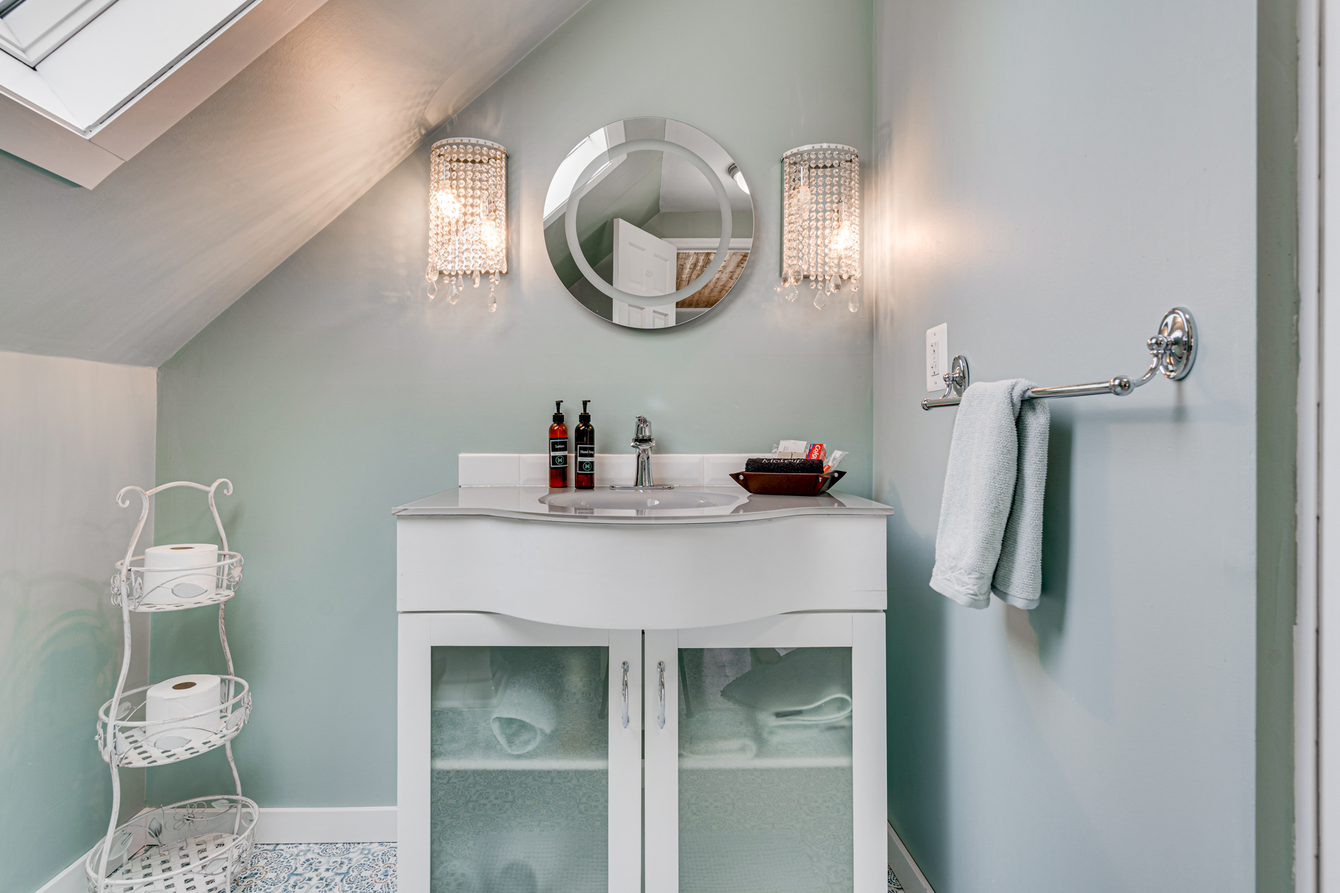 Chic and serene bathroom featuring elegant decor and modern fixtures.